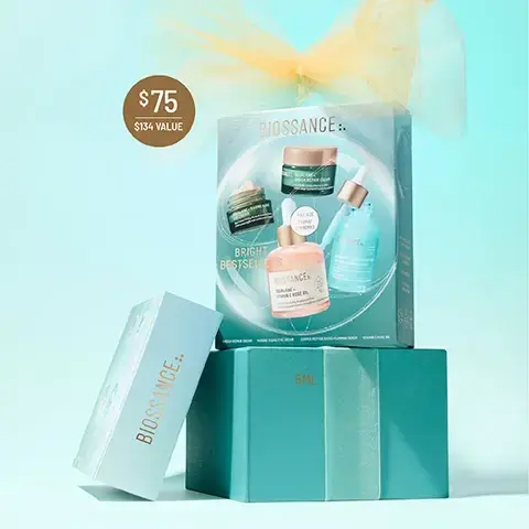 Image 2-biossance-en_US - A Biossance skincare gift set is displayed with a large teal box showcasing four products, stacked on a smaller teal box, with a light blue Biossance box leaning against it, all adorned with a gold tulle bow on a light blue background, and includes the text $75, $134 VALUE, BIOSSANCE, BRIGHT BESTSELLERS, FULL SIZE FORMAT STANDARD, SQUALANE + OMEGA REPAIR CREAM, SQUALANE + MARINE ALGAE EYE CREAM, SQUALANE + COPPER PEPTIDE RAPID PLUMPING SERUM, SQUALANE + VITAMIN C ROSE OIL, 5ML. Image 3-biossance-en_US - The image shows four Biossance skincare products with water droplets on a glittery golden ribbon: a pink dropper bottle, labeled BIOSSANCE:: SQUALANE + VITAMIN C ROSE OIL, Facial Oil to Visibly Brighten & Firm, Huile visage pour éclaircir et raffermir visiblement, with a SUGARCANE SQUALANE logo, and a separate label FULL SIZE 50ML; a small green jar with peach cream, labeled BIOSSANCE:: SQUALANE + MARINE ALGAE EYE CREAM, Eye Cream Visibly Firms & Instantly Smooths, Crème yeux raffermit visiblement et lisse instantanément, and a separate label 5ML; a green jar with white cream, labeled BIOSSANCE:: SQUALANE + OMEGA REPAIR CREAM, Face Cream Deeply Moisturizes Skin, Crème visage hydratant la peau en profondeur, and a separate label 15ML; and a blue dropper bottle, labeled BIOSSANCE:: SQUALANE + COPPER PEPTIDE RAPID PLUMPING SERUM, Instant Hydration with Hyaluronic Acid & Paracress, Une hydratation instantanée avec de lacide hyaluronique et du Cresson du Pará, with a SUGARCANE SQUALANE logo, and a separate label NEW EXCLUSIVE SIZE 15ML. Image 4-biossance-en_US - Various Biossance skincare products, including two jars and two dropper bottles, are artfully arranged on a light blue background with water droplets, accompanied by prominent text displaying product effectiveness statistics and details: MARINE ALGAE EYE CREAM 97% SHOWED IMPROVEMENT IN THE APPEARANCE OF FINE LINES AND WRINKLES AFTER 1 USE¹, VITAMIN C ROSE OIL 97% AGREE SKIN FIRMNESS AND SUPPLENESS IS IMPROVED², OMEGA REPAIR CREAM 100% SHOWED IMPROVEMENT IN SKIN HYDRATION³; visible product labels include BIOSSANCE: SQUALANE + MARINE ALGAE EYE CREAM Eye Cream Visibly Firms & Instantly Smooths Crème yeux raffermit visiblement et lisse instantanément, BIOSSANCE: SQUALANE + VITAMIN C ROSE OIL Facial Oil to Visibly Brighten & Firm Huile visage pour éclaircir et raffermir visiblement SUGARCANE SQUALANE, BIOSSANCE: SQUALANE + COPPER PEPTIDE RAPID PLUMPING SERUM Instant Hydration with Hyaluronic Acid & Paracress Une hydratation instantanée avec de lacide hyaluronique et du cresson de Para SUGARCANE SQUALANE, BIOSSANCE: SQUALANE + OMEGA REPAIR CREAM Face Cream Deeply Moisturizes Skin Crème visage hydratant la peau en profondeur; and footnotes provide context: ¹ Based on a clinical study of 33 female subjects ² Based on a 21-day consumer study of 32 women with twice daily use ³ Based on a 28-day consumer study of 31 women ⁴ Based on a clinical study of 35 women. Image 5-biossance-en_US - The image displays a four-step skincare regimen titled Bright Bestsellers Routine, featuring four products: Step 1 is BIOSSANCE. SQUALANE + MARINE ALGAE EYE CREAM, which instantly firms and lifts under eyes; Step 2 is BIOSSANCE:: SQUALANE + COPPER PEPTIDE RAPID PLUMPING SERUM, which instantly hydrates & visibly plumps; Step 3 is BIOSSANCE. SQUALANE + OMEGA REPAIR CREAM, offering rich facial hydration with weightless absorption; and Step 4 is BIOSSANCE:: SQUALANE + VITAMIN C ROSE OIL, which brightens and evens skin tone, all noted as Suitable for Sensitive Skin. Image 6-biossance-en_US - Four swatches of skincare products are spread on a light blue background: a peach-colored cream with text Marine Algae Eye Cream, a white cream with text Omega Repair Cream, a clear liquid with text Vitamin C Rose Oil, and a blue gel with text Copper Peptide Plumping Serum, along with a few clear droplets. Image 7-biossance-en_US - The image shows two angled rectangular Biossance skincare gift sets, one teal-blue and one peach-pink, against a light background, with the top banner reading ILLUMINATE YOUR GIFT LIST; the upper teal Bright Bestsellers set, described as Enhanced Glow + Hydration, is priced at $75 ($134 VALUE) and displays visible products BIOSSANCE:: SQUALANE + OMEGA REPAIR CREAM (Face Cream Deeply Moisturizes Skin), BIOSSANCE:: SQUALANE + MARINE ALGAE EYE CREAM (Eye Cream Visibly Firms & Instantly Smooths), and BIOSSANCE:: SQUALANE + COPPER PEPTIDE RAPID PLUMPING SERUM (Intensive hydration with Hyaluronic Acid), with text also stating FULL SIZE FORMAT STANDARD, DERMATOLOGIST TESTED, VEGAN, SUITABLE DURING PREGNANCY, NON-COMEDOGENIC, FOR ALL SKIN TYPES; the lower peach Uplifting Glow set, described as Visibly Firms + Hydrates, is priced at $65 ($112 VALUE) and displays visible products BIOSSANCE:: SQUALANE + MARINE ALGAE EYE CREAM (Eye Cream Visibly Firms & Instantly Smooths), BIOSSANCE:: SQUALANE + OMEGA REPAIR CREAM (Face Cream Deeply Moisturizes Skin), BIOSSANCE:: SQUALANE + VITAMIN C ROSE OIL (Facial Oil to Visibly Brighten & Firm), and BIOSSANCE:: SQUALANE + FIRM AND LIFT DUAL SERUM (Visibly Tightens + Hydrates), with text also stating FULL SIZE FORMAT STANDARD.