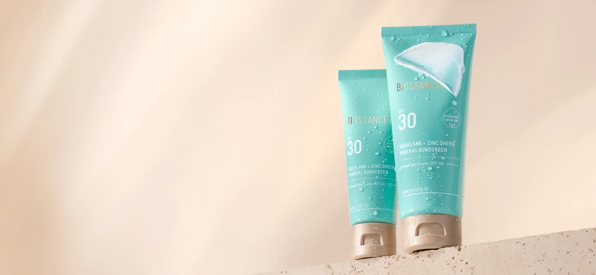 Model holding Zinc Sheer Mineral SPF 30 Sunscreen